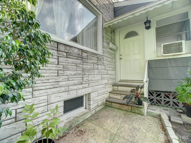 451 Burroughs Ter, Union Twp, NJ 07083 - doorway to property with stone siding and cooling unit