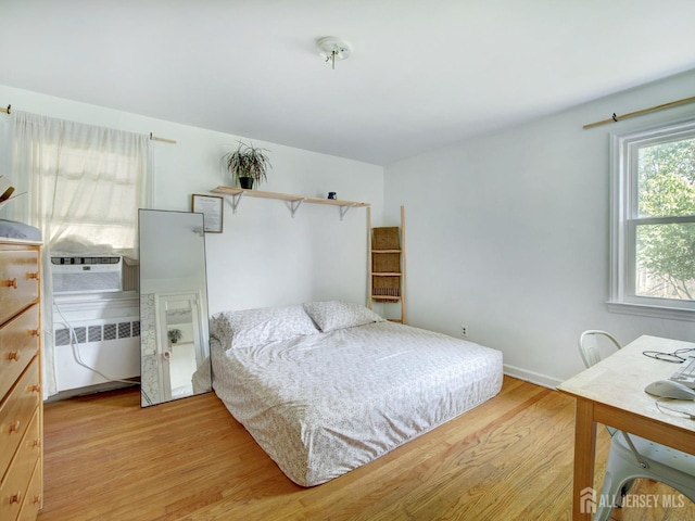 451 Burroughs Ter, Union Twp, NJ 07083 - bedroom featuring light wood-style flooring, radiator, and cooling unit