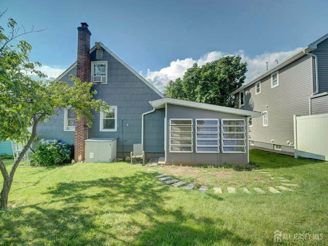 451 Burroughs Ter, Union Twp, NJ 07083 - back of property with a yard and a chimney