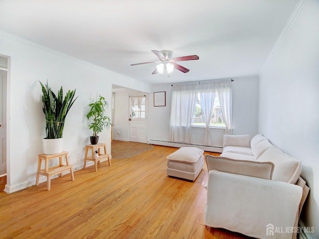 451 Burroughs Ter, Union Twp, NJ 07083 - living room with baseboard heating, crown molding, light wood-type flooring, and a ceiling fan