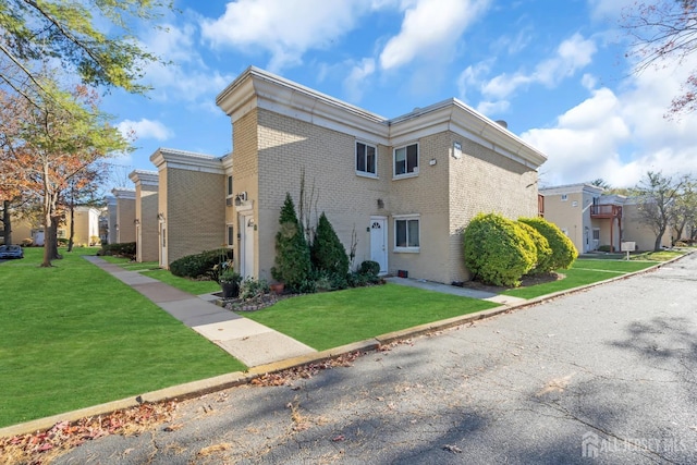 view of home's exterior with a lawn