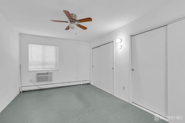 unfurnished bedroom featuring ceiling fan, an AC wall unit, and baseboard heating