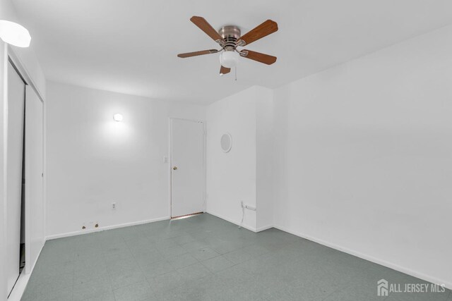 unfurnished room featuring ceiling fan