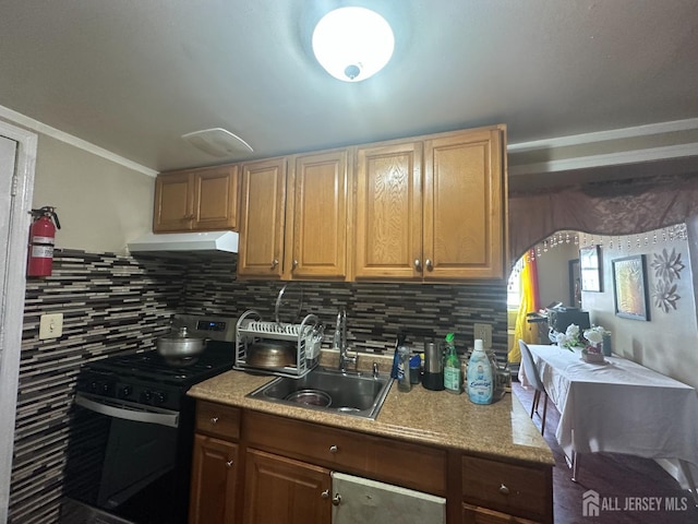 146 Seaman St, New Brunswick, NJ 08901 - kitchen with range with gas cooktop, under cabinet range hood, tasteful backsplash, light countertops, and ornamental molding