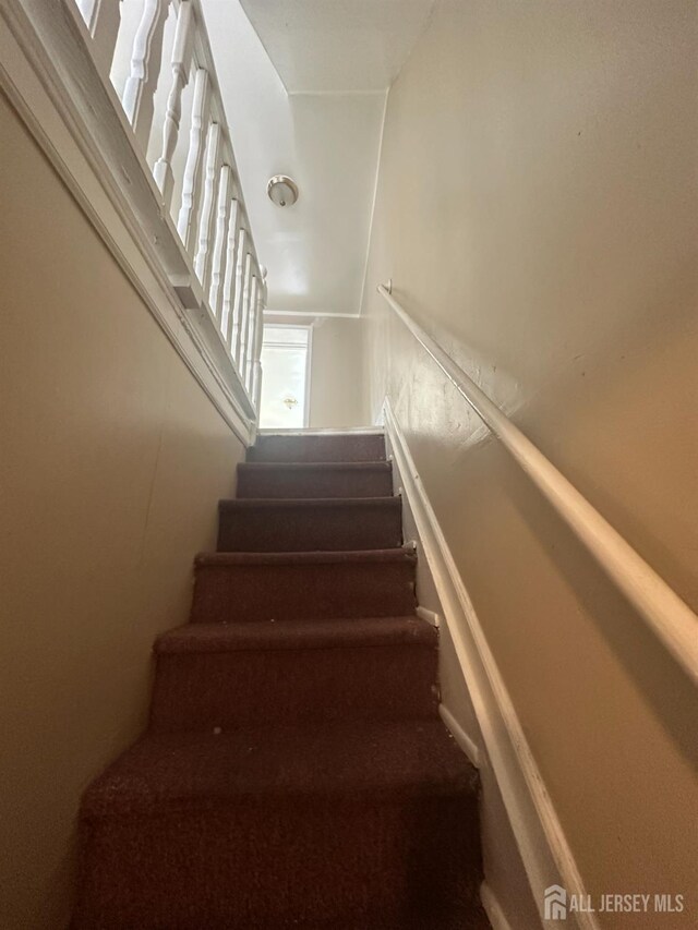 146 Seaman St, New Brunswick, NJ 08901 - staircase featuring carpet