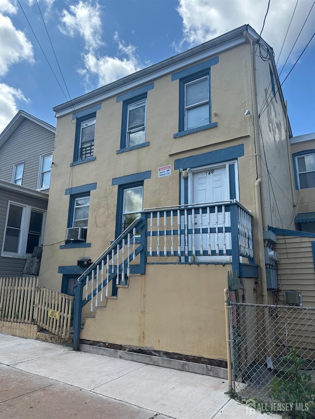 146 Seaman St, New Brunswick, NJ 08901 - view of property with stucco siding