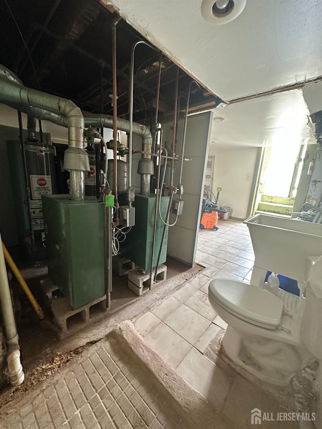146 Seaman St, New Brunswick, NJ 08901 - utility room with gas water heater and a heating unit