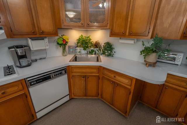 173 N Main St, Milltown, NJ 08850 - kitchen with white dishwasher, light countertops, and brown cabinets