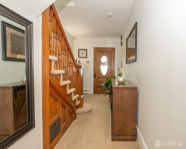 173 N Main St, Milltown, NJ 08850 - foyer entrance featuring light carpet, baseboard heating, and stairs