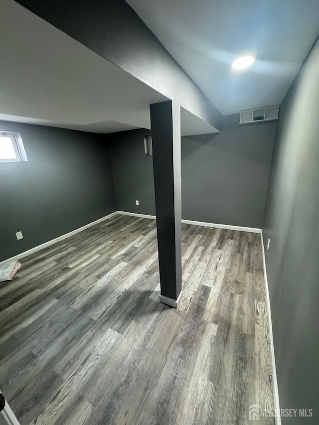 basement with wood-type flooring