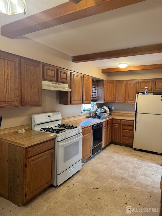 kitchen with beam ceiling, sink, and white appliances