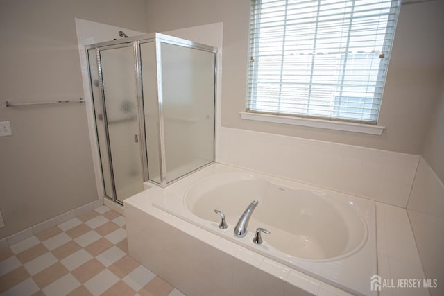 full bath with a shower stall and a bath