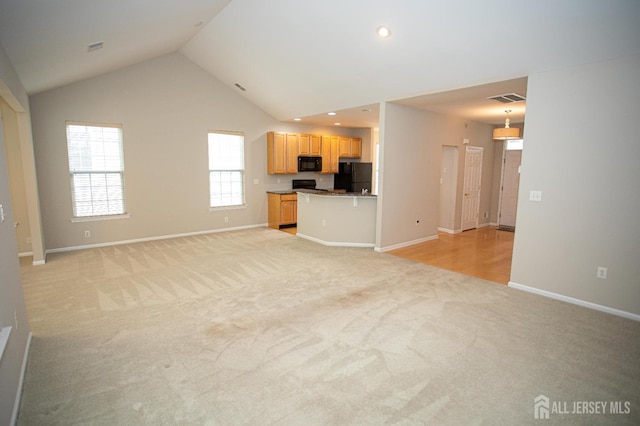 unfurnished living room featuring light carpet, vaulted ceiling, baseboards, and recessed lighting