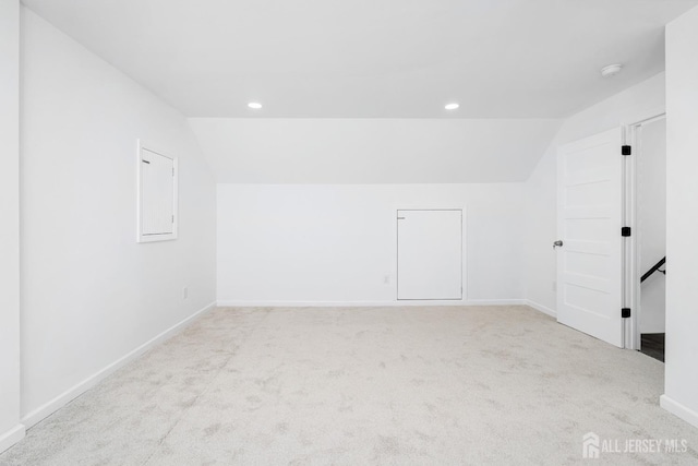 bonus room featuring light carpet and lofted ceiling