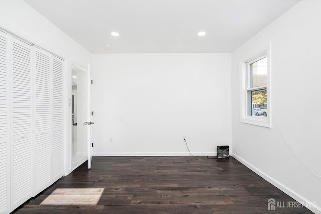 laundry area with dark hardwood / wood-style floors