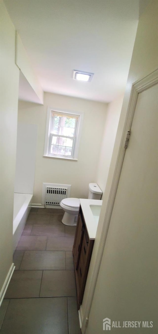308 Codrington Pl, Bound Brook, NJ 08805 - full bath with radiator, vanity, a tub, and tile patterned floors