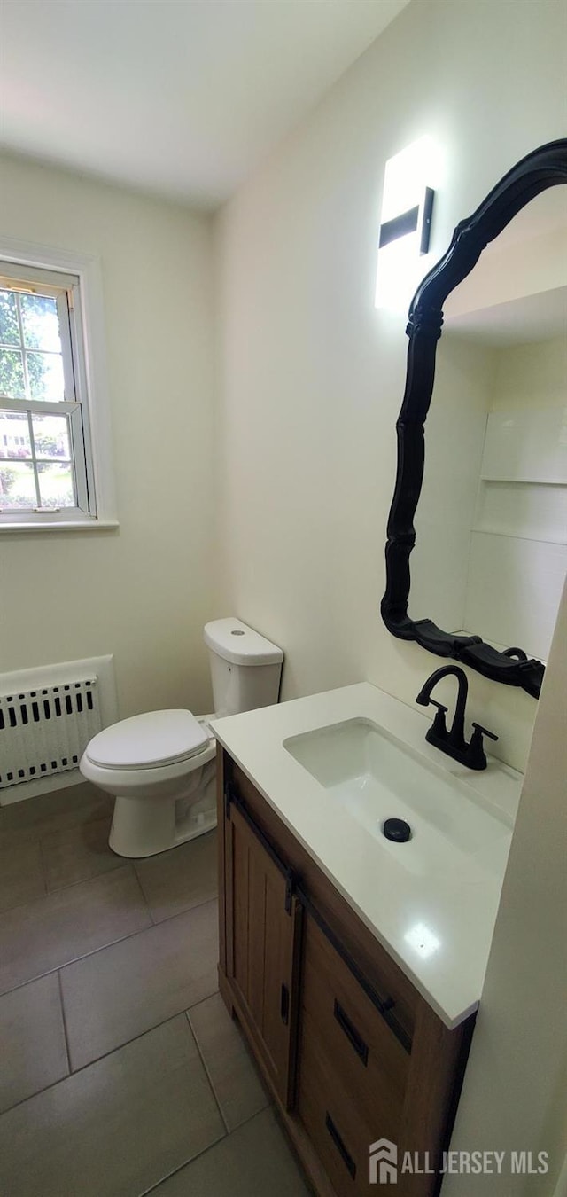 308 Codrington Pl, Bound Brook, NJ 08805 - bathroom with radiator heating unit, vanity, and tile patterned floors