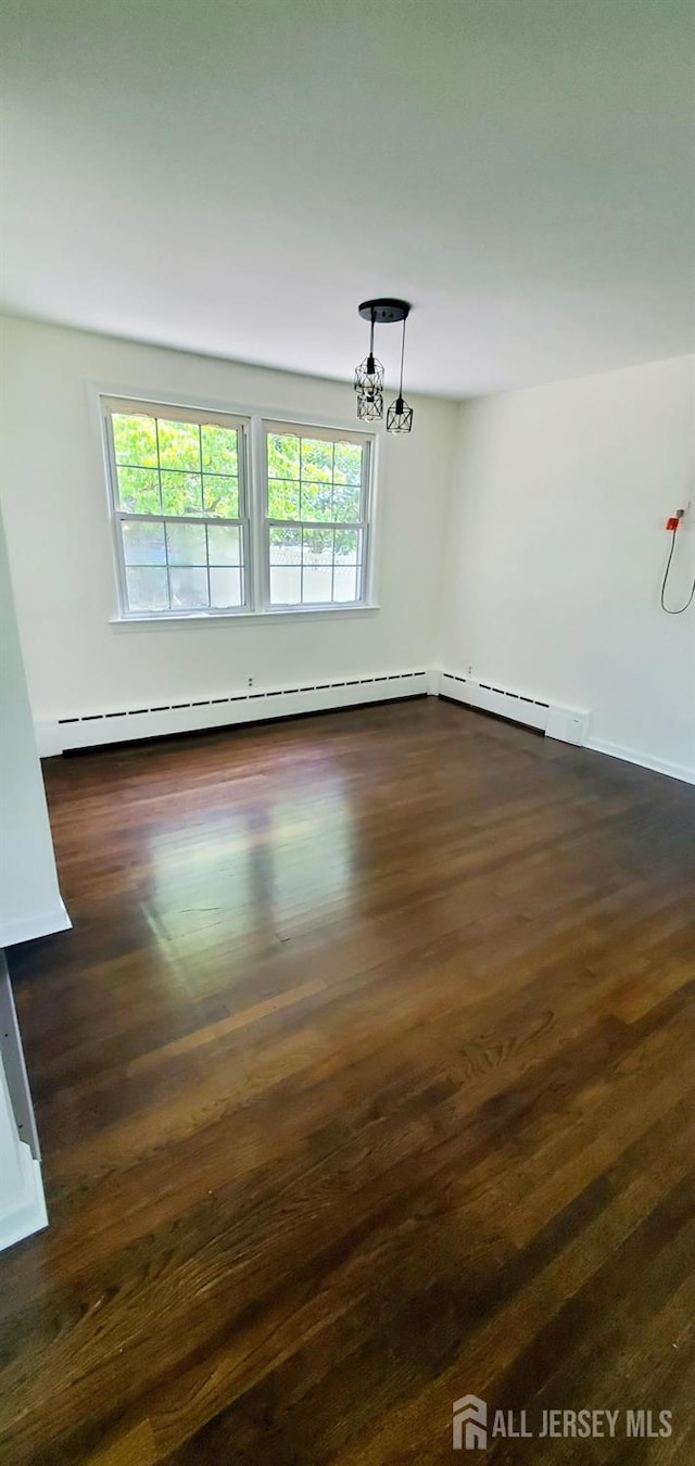 308 Codrington Pl, Bound Brook, NJ 08805 - unfurnished room featuring healthy amount of natural light, a chandelier, and dark wood finished floors
