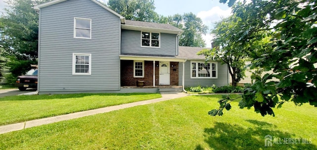 308 Codrington Pl, Bound Brook, NJ 08805 - traditional home with brick siding, a front lawn, and roof with shingles