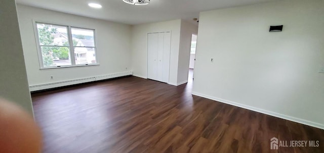 308 Codrington Pl, Bound Brook, NJ 08805 - unfurnished room featuring baseboard heating and dark wood-style flooring