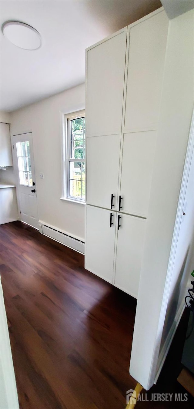 308 Codrington Pl, Bound Brook, NJ 08805 - foyer with baseboard heating and dark wood finished floors