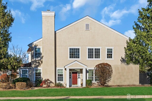 view of front of home with a front lawn