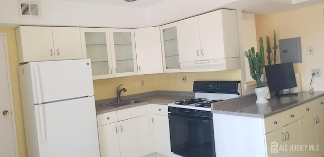 kitchen featuring white cabinetry, sink, exhaust hood, electric panel, and white appliances