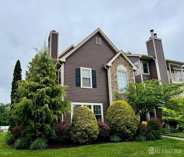 204 Blew Ct, East Brunswick, NJ 08816 - view of side of home featuring a chimney and stone siding
