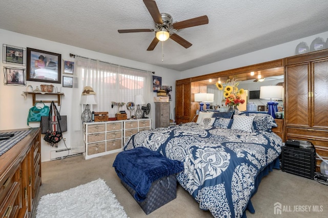 109-B Hemlock Plz, Monroe, NJ 08831 - carpeted bedroom featuring baseboard heating, a textured ceiling, and ceiling fan