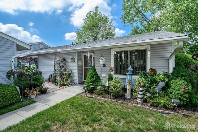 109-B Hemlock Plz, Monroe, NJ 08831 - view of front of property with a front yard and a shingled roof