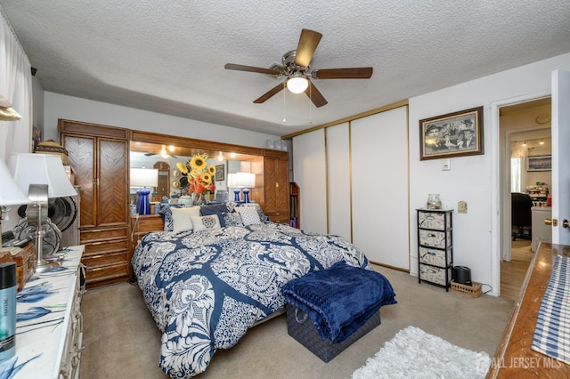 109-B Hemlock Plz, Monroe, NJ 08831 - bedroom featuring a closet, light carpet, a textured ceiling, and a ceiling fan