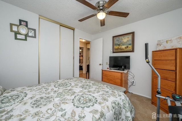 109-B Hemlock Plz, Monroe, NJ 08831 - bedroom featuring a closet, carpet floors, a textured ceiling, and a ceiling fan
