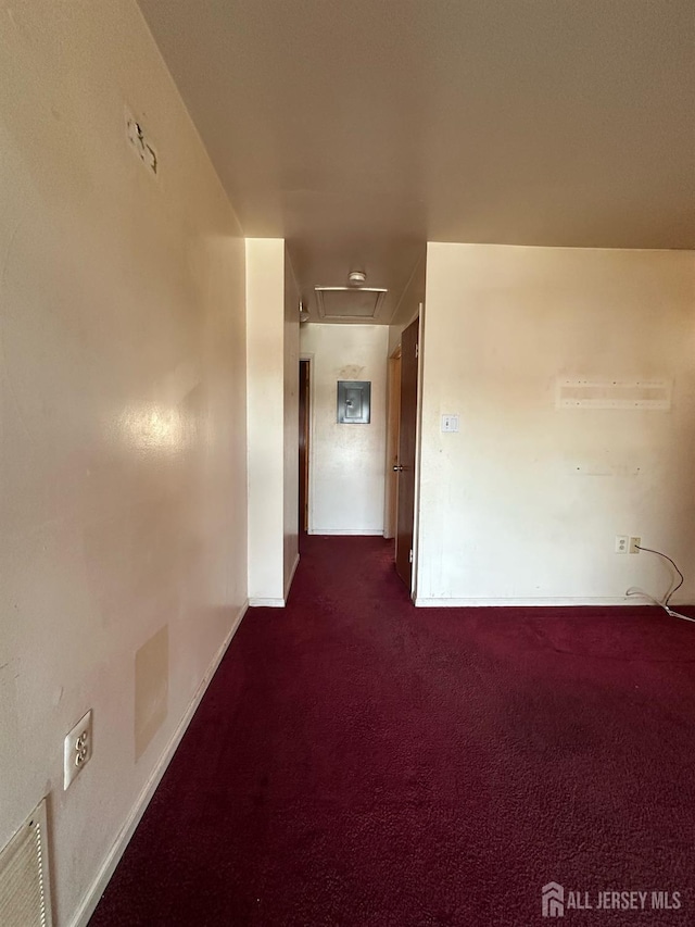 corridor with visible vents and dark colored carpet