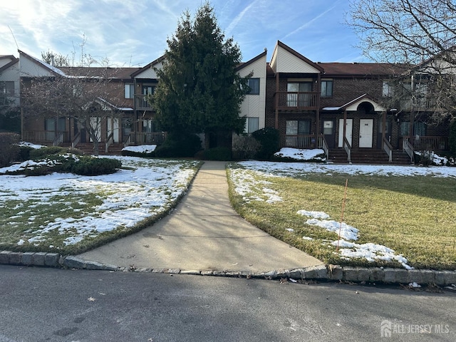 surrounding community featuring a lawn