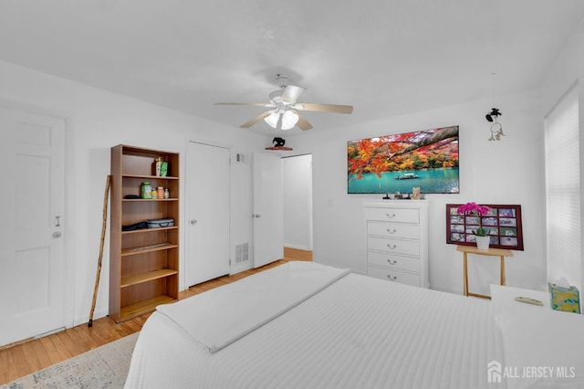 323 Gill Ln Unit 11Q, Iselin, NJ 07067 - bedroom with wood finished floors, baseboards, and a ceiling fan