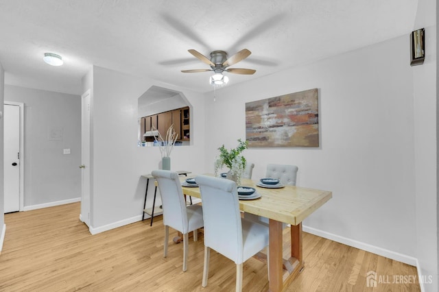 323 Gill Ln Unit 11Q, Iselin, NJ 07067 - dining room with a ceiling fan, wood finished floors, and baseboards
