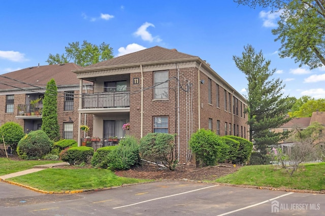 323 Gill Ln Unit 11Q, Iselin, NJ 07067 - view of property with uncovered parking