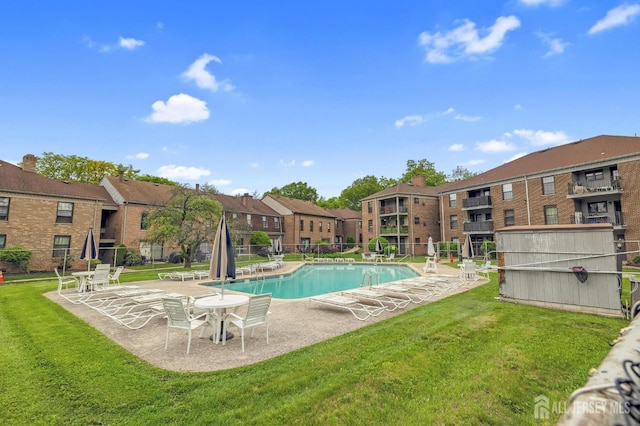 323 Gill Ln Unit 11Q, Iselin, NJ 07067 - community pool featuring a lawn, a patio, and a residential view