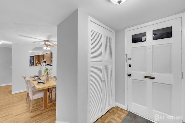 323 Gill Ln Unit 11Q, Iselin, NJ 07067 - entryway with baseboards, ceiling fan, and light wood-type flooring