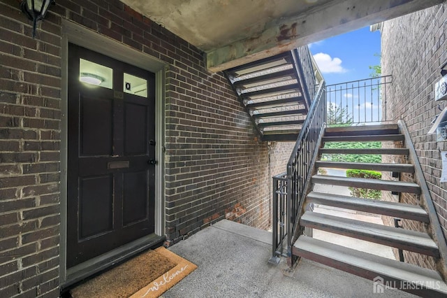 323 Gill Ln Unit 11Q, Iselin, NJ 07067 - doorway to property with brick siding