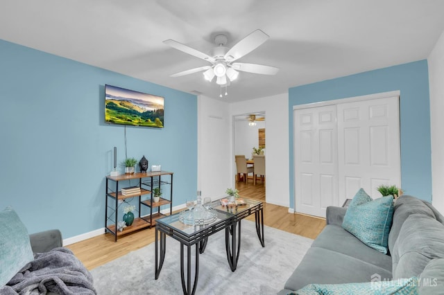 323 Gill Ln Unit 11Q, Iselin, NJ 07067 - living room featuring ceiling fan, light wood finished floors, and baseboards