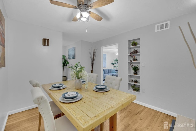 323 Gill Ln Unit 11Q, Iselin, NJ 07067 - dining space featuring light wood-style floors, baseboards, and a ceiling fan