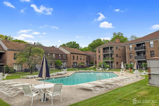323 Gill Ln Unit 11Q, Iselin, NJ 07067 - community pool featuring a patio area and a residential view