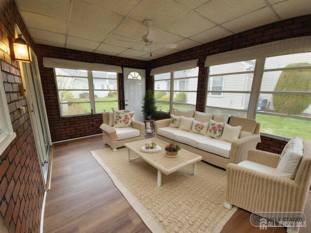 467 New Haven Way Unit A, Monroe, NJ 08831 - sunroom featuring a paneled ceiling, brick wall, wood finished floors, ceiling fan, and an outdoor living space