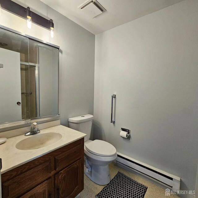 467 New Haven Way Unit A, Monroe, NJ 08831 - full bathroom featuring baseboard heating, vanity, toilet, and an enclosed shower