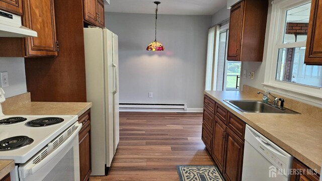 467 New Haven Way Unit A, Monroe, NJ 08831 - kitchen featuring under cabinet range hood, white appliances, a sink, baseboard heating, and dark wood-style floors