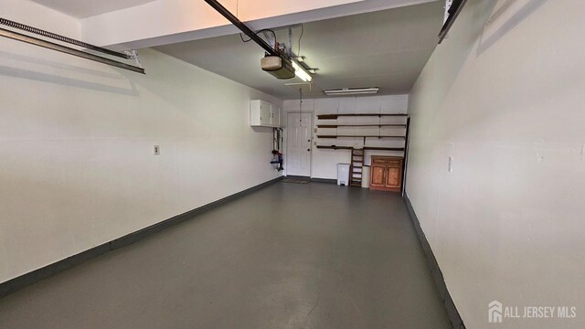 467 New Haven Way Unit A, Monroe, NJ 08831 - garage featuring a garage door opener and baseboards