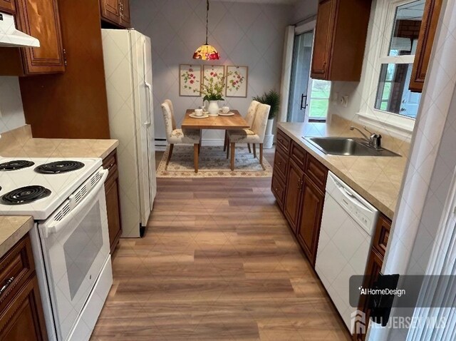 467 New Haven Way Unit A, Monroe, NJ 08831 - kitchen featuring white appliances, a sink, under cabinet range hood, tile counters, and hanging light fixtures