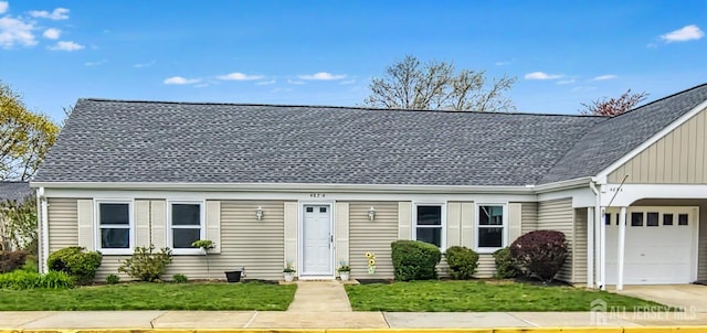 467 New Haven Way Unit A, Monroe, NJ 08831 - view of front of home featuring an attached garage, a front lawn, roof with shingles, and board and batten siding