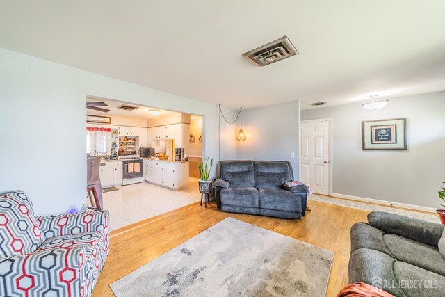 119 Carteret Ave, Carteret, NJ 07008 - living room with light wood-style floors